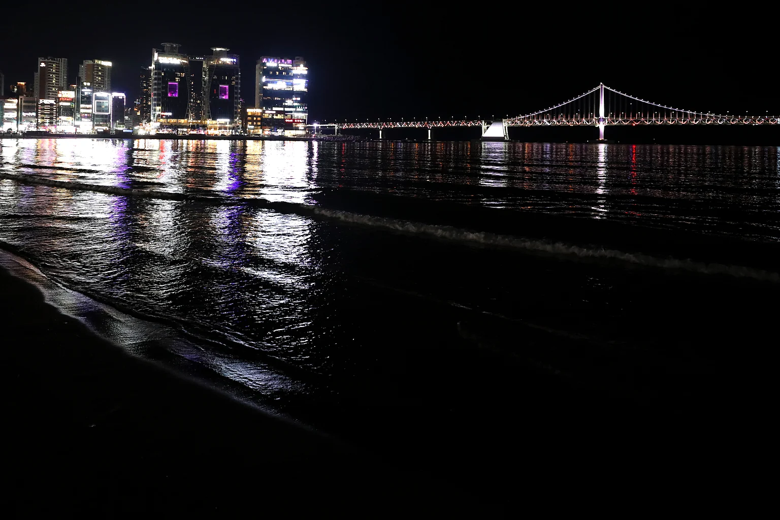 Gwangan Bridge and the Busan night skyline seen from Gwangalli Beach